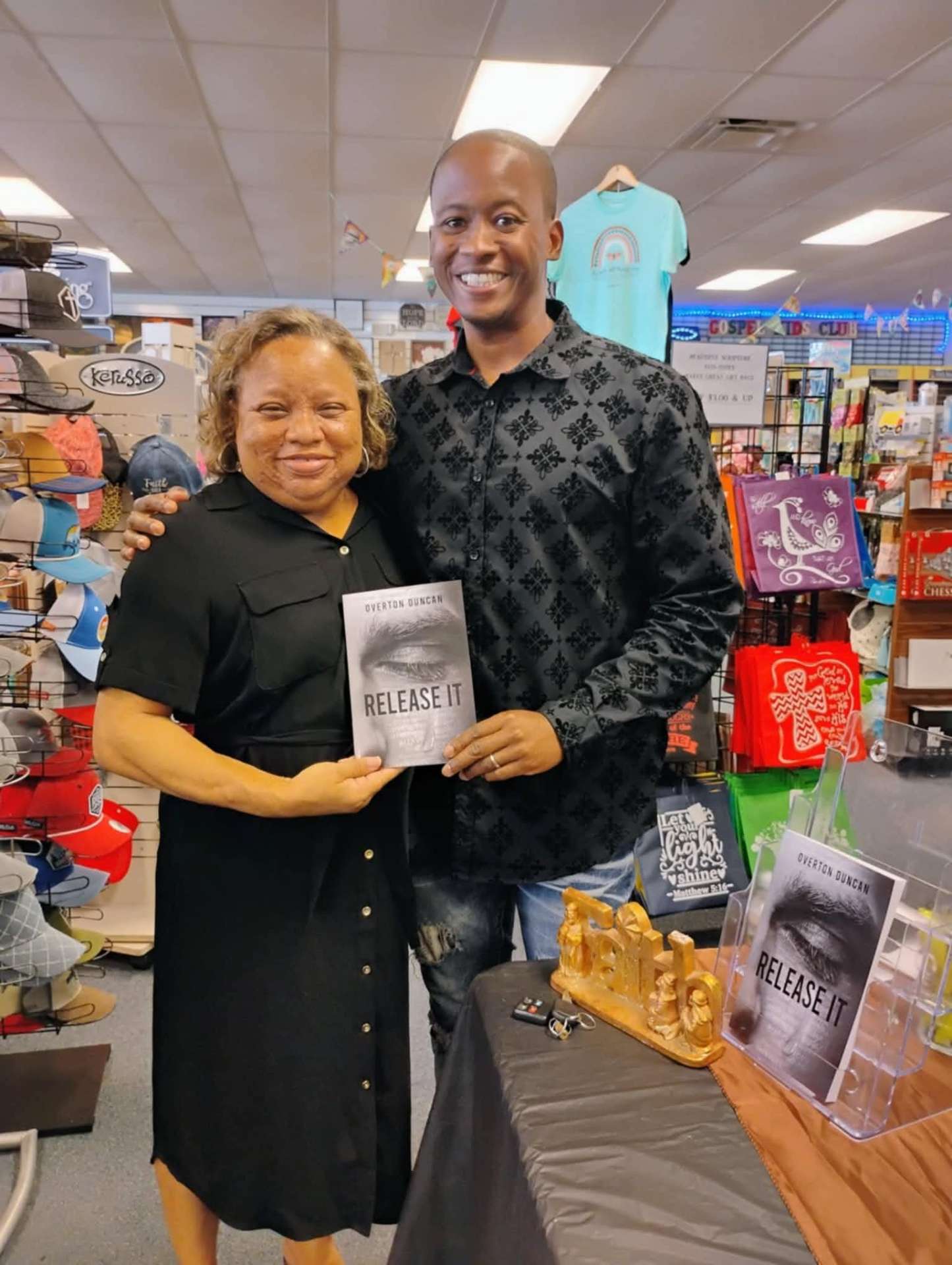 Overton Duncan with a reader at a Christian bookstore